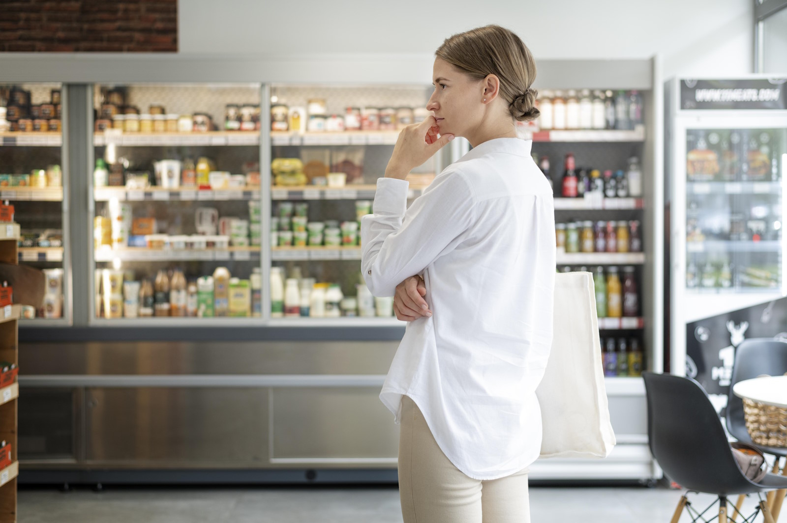 medium-shot-woman-shop-thinking.jpg